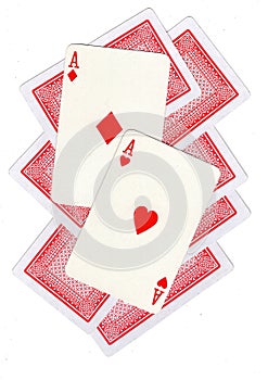 A montage of playing cards with two red aces revealed.