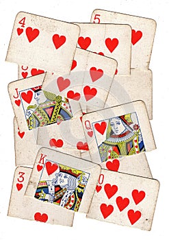 A montage of torn halves of vintage playing cards featuring hearts.