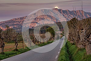 Montagne Sainte-Victoire with the moon behind the cross photo