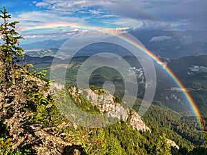 Montain hike on the ridge of Piatra Craiului Mountains with rainbow