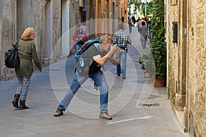 Travel-photographer on the street of old city