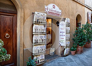 Montalcino, Tuscany, Italy. August 2020. The typical local wine shops overlook the main street of the village, primarily the