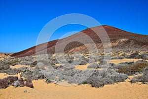 Montana Bermeja at the beach Playa de las Conchas. The island La Graciosa, belonging to Lanzarote, Canary Islands, Spain