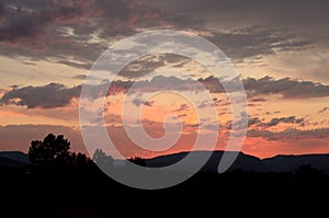 Montana Sunset Sky with silouette of mountains and trees