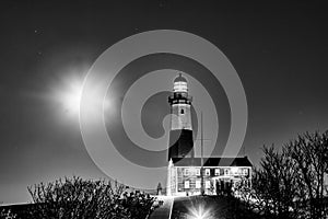 Montauk Point Light lighthouse with moon shine by night, Long Island, New York