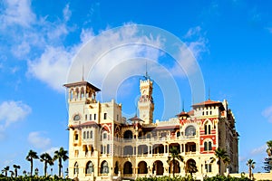 Montaza Palace surrounded by palm trees on a sunny day in Alexandria, Egypt