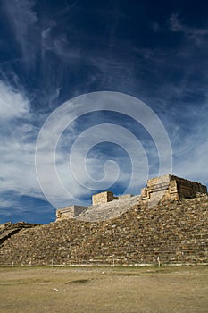 Monte Alban Oaxaca Mexico pyramid slope and sky with clouds