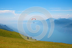 Monte Baldo mountain italy, paraglider floating over lake garda