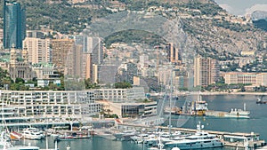 Monte Carlo city aerial panorama timelapse. View of luxury yachts and buildings in harbor of Monaco, Cote d`Azur.