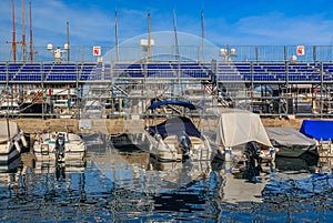 Monte Carlo panorama with luxury yachts and grand stands by the in harbor for Grand Prix F1 race in Monaco, Cote d'Azur