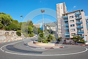 Monte Carlo street curve with formula one red and white signs in a sunny summer day in Monte Carlo, Monaco