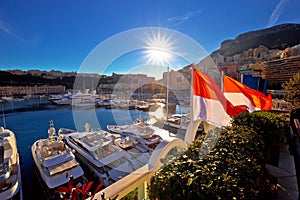 Monte Carlo yachting harbor and colorful waterfront sun haze view