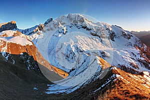 Monte Cernera in autumn with first snow, Dolomites, Italy, Europe Beautiful mountains scenery in sunset.