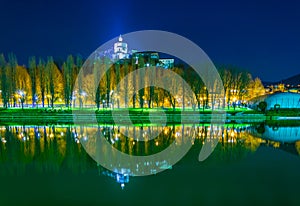 Monte dei Cappuccini e Chiesa di Santa Maria al Monte reflecting on the river po during night in turin - torino...IMAGE