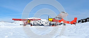 Monte Pora, Bergamo, Italy. A single engined, general aviation red light aircrafts parked on a snow covered plateau