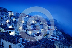 Monte Sant`Angelo town in Foggia, Gargano peninsula in Italy. Night scene with old buildings with lights. Travel in Europe, magi