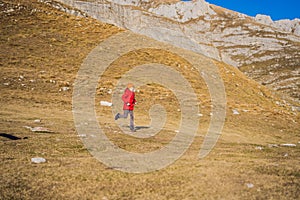 Montenegro. Boy tourist on the background of Durmitor National Park. Saddle Pass. Alpine meadows. Mountain landscape