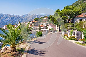 Montenegro. Embankment of seaside town of Perast on sunny autumn day