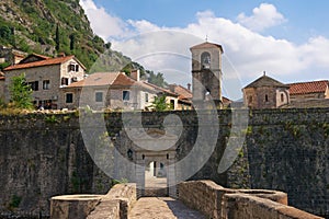 Montenegro . Old Town of Kotor . View of northern walls of ancient fortress, River Gate and church of St. Mary