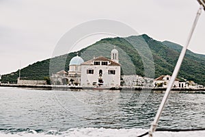 Montenegro. Perast. 16.05.2020 Boka island Church of Our Lady of the Rocks Kotor Bay. View from the boat