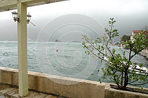 Montenegro port, wavy sea and misty weather