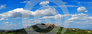 Montepulciano with blue sky and white clouds