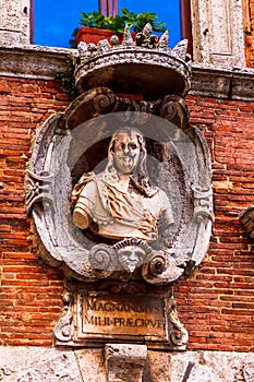 Sculpture on the facade of the building in Montepulciano, Siena, Italia photo