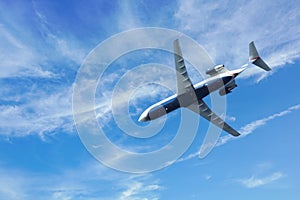 Monterey, CA, USA - March 24, 2024: US Airways Express jet passes overhead photo