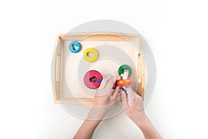 Montessori material. Hand of a child