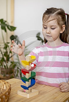 Montessori material. Home education. Mom and daughter are learning musical instruments