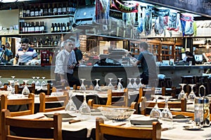 Steak Parrilla Restaurant with counter, stools and wooden chairs