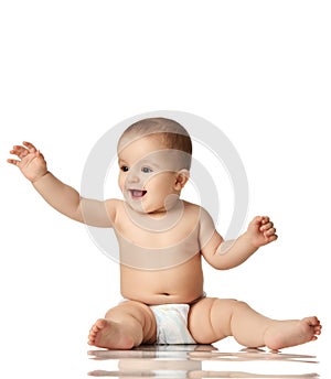 8 month infant child baby boy kid toddler sitting in diaper thinking happy laughing isolated on a white