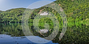 Monticchio Lake with famous Abbey and Monte Vulture, Basilicata, Italy photo