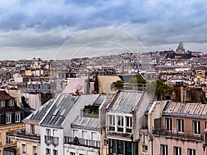 Montmartre Sacre Coeur view in and Paris over downtown buildings
