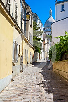 Montmartre in summer, Rue Saint Rustique, Paris, France photo