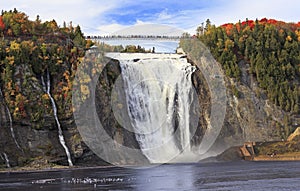 Montmorency Falls and Bridge in autumn with colorful trees, Quebec