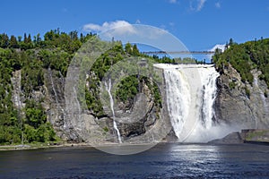 Montmorency waterfall on the background of blue sky