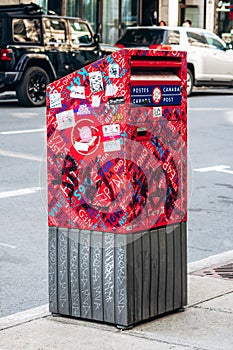 A bright red Canada Post mailbox