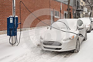 Electric car getting charged in Montreal