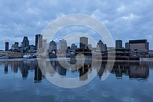 Montreal downtown skyline reflected in the St. Lawrence river