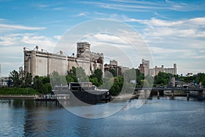 Montreal famous building Silo 5 by the river and showing Bota Bota spa