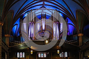 Montreal Notre Dame Basilica, inside the Catholic church - pipe organ, ancient decoration, Gothic style, stained glass windows, co