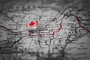 Montreal pinned on a map with the flag of Canada