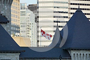 Montreal, QC, Canada - 8-4-2021: Flag of McGill university flies in the air in a windy day with a background of a clear blue sky.