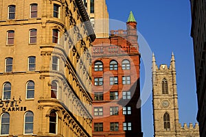 Montreal with Evening Light on Historic Buildings at Place d`Armes, Quebec, Canada photo