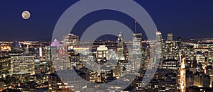 Montreal skyline at night, including a beautiful full moon