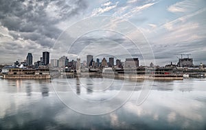 Montreal skyline reflected on the river on a cloudy morning