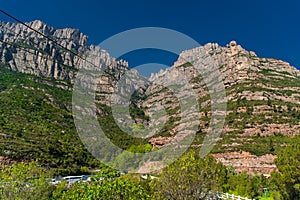 Montserrat, Spain - April, 2019: Santa Maria de Montserrat Abbey in Monistrol de Montserrat, Catalonia, Spain. Famous for the