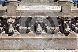 Monument with carved stone animal heads in front of the Bellas Artes museum in Santiago do Chile