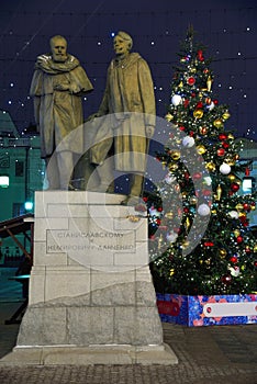 Monument in Chamberlain lane on the Christmas tree background at night, Moscow, Russia